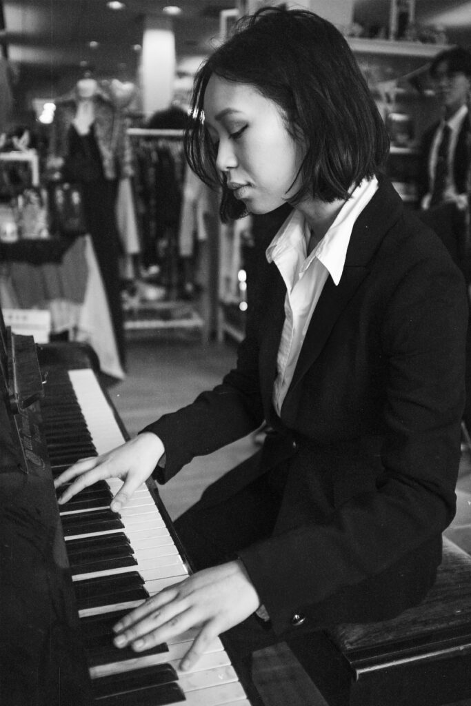 Reese Carly Manglicmot playing the piano in Glasgow